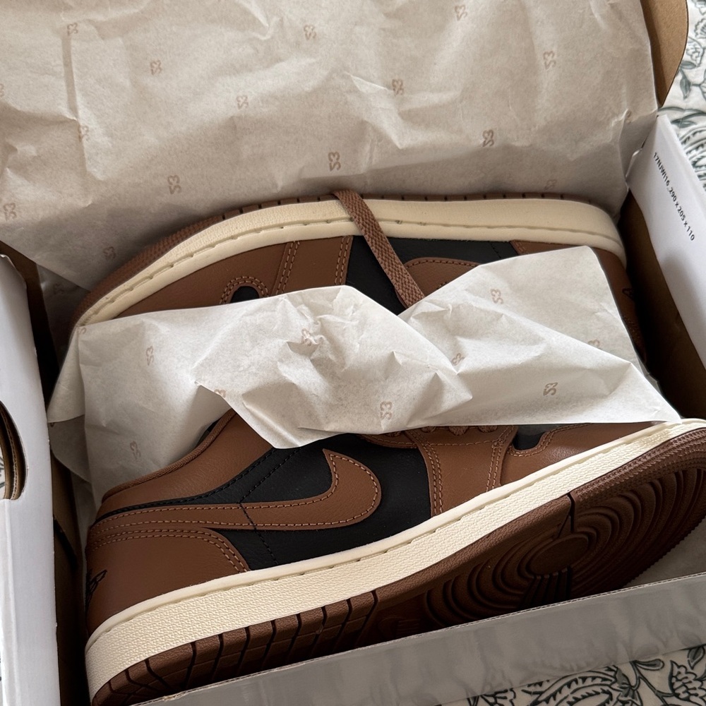 Jordan 1 Low WMNS in Black, Brown, and Cream